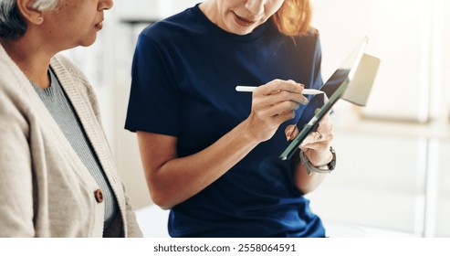 Senior patient, physiotherapist and tablet in consultation for injury recovery, medical chart and healthcare report. Health professional, people or digital app with stylus for rehabilitation progress - Powered by Shutterstock