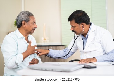 senior patient visitng doctor due to suffering chest pain at hospital - concept of health check up, illness or decease and medical treatment. - Shutterstock ID 2152167995