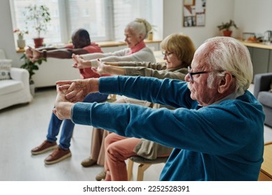 Senior people doing exercises in the morning - Powered by Shutterstock