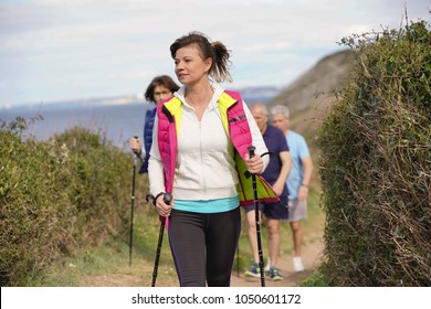 Senior people nordic walking by the atlantic coast - Powered by Shutterstock