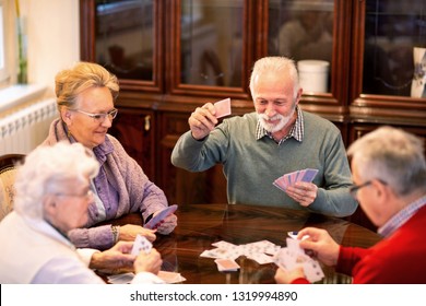 Senior People Playing Card Games And Having Fun In Doing So