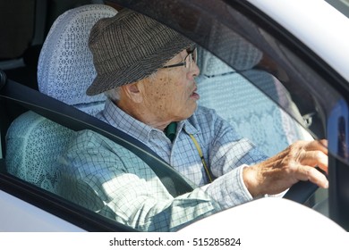 Senior Person Driving A Car