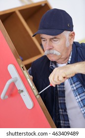 Senior Professional With Different Types Of Keys In Locksmith