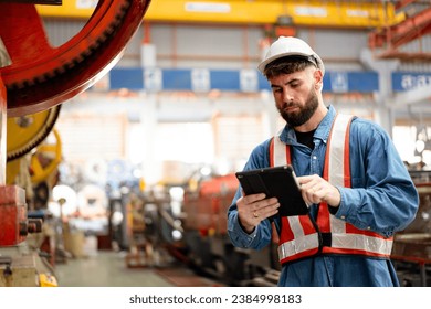 Senior professional electrical or industrial engineer inspecting and repairing a robotic system in the manufacturing factory close up. Robotic technician repairing - fixing a automated machine. - Powered by Shutterstock