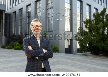 Senior professional man, stylish in a business suit, standing confidently with arms crossed outside an office. Personifies experience and success.