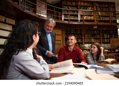 The senior professor gives a lecture to the students at the University library - Powered by Shutterstock