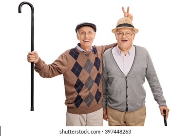 Senior Pulling A Bunny Fingers Prank On His Friend Isolated On White Background