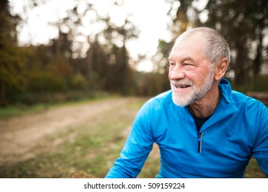 Senior runner in nature. Man resting, smiling. Close up. - Powered by Shutterstock