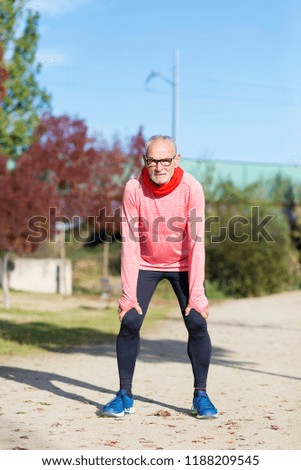 Similar – Senior runner man sitting after jogging in a park