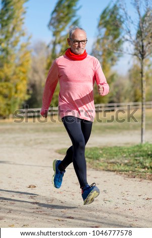 Similar – Blick auf den älteren Mann, der durch den Park joggt.