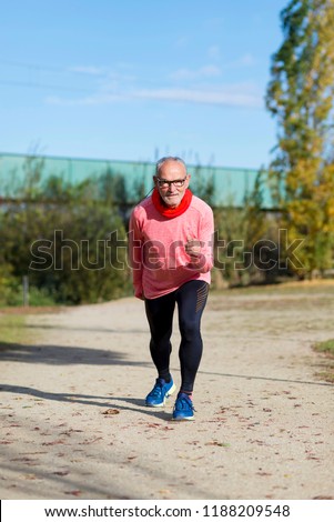 Similar – Senior runner man sitting after jogging in a park