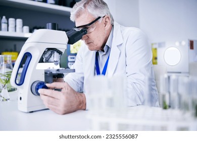 Senior scientist, man and microscope, analysis and science study with medical research and biotechnology in lab. Male person, doctor and pathology, check test sample with scientific experiment - Powered by Shutterstock