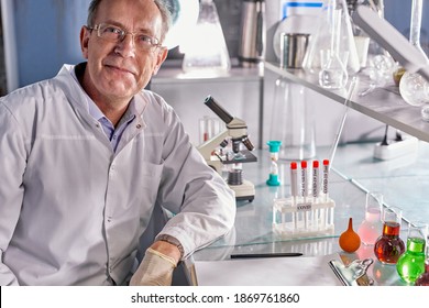 senior scientist man in white dress coat sitting in laboratory at work place, successful face and feeling expression. caucasian microbiologist make research - Powered by Shutterstock
