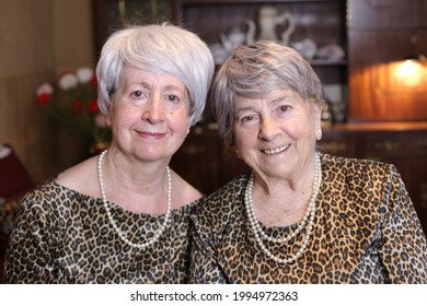 Senior Sisters With Matching Leopard Outfits