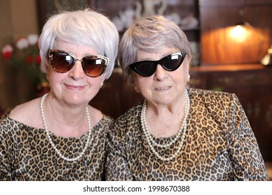 Senior Sisters With Matching Leopard Outfits