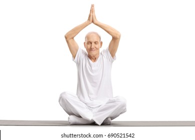 Senior Sitting On An Exercise Mat And Meditating Isolated On White Background