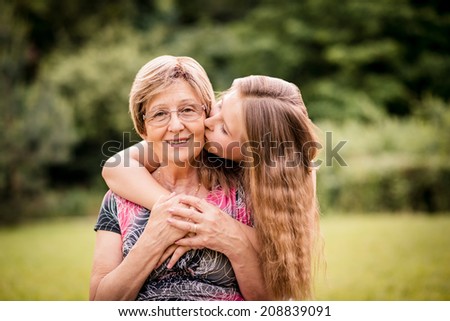 Similar – Senior woman in a wheelchair with daughter in garden