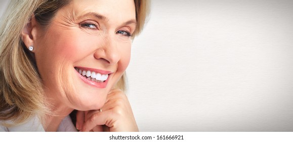 Senior Smiling Woman Portrait. Over Grey Background.