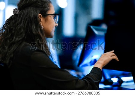 Senior software engineer debugging backend architecture code during agile sprint. Female developer reviewing syntax optimization strategy on digital screen.