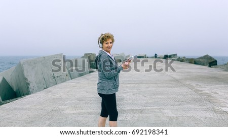 Similar – Two women walking by sea pier