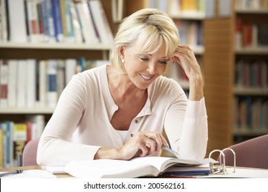 Senior Student Working In Library