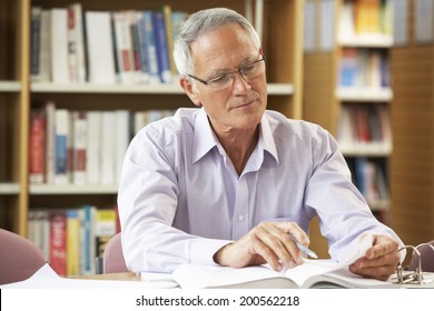 Senior Student Working In Library