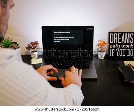Senior Systems Administrator Engineer Falls Victim to Administor Spear Phishing Email Triggering Ransomware Encryption Virus - Cybersecurity Concept