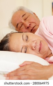 Senior Taiwanese Couple Sleeping