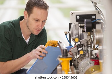 Senior technician repairing agriculture machinery in a greenhouse
 - Powered by Shutterstock