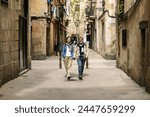 Senior tourist couple walking around Barcelona city enjoying summer vacation. Travel and holiday lifestyle concept.