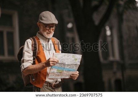 Senior tourist exploring a new city, exploring interesting places