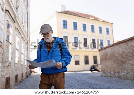 Similar – Image, Stock Photo Man traveling solo by train looking outside the window