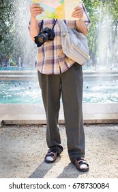 Senior Tourist Man With Camera And Map Socks And Sandals