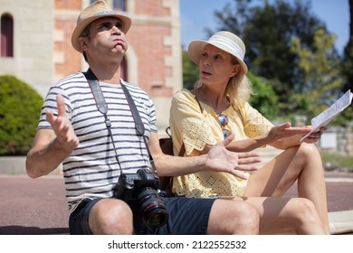 Senior Tourist Upset Looking At A Map For A Way