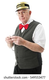 A senior train conductor holding his pocket watch.  On a white background.