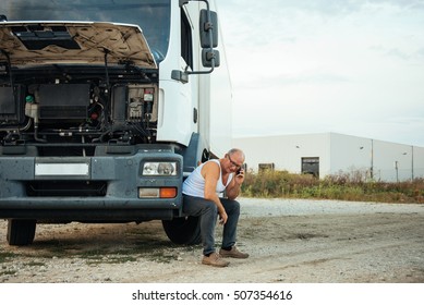 Senior Truck Driver Talking On The Phone.