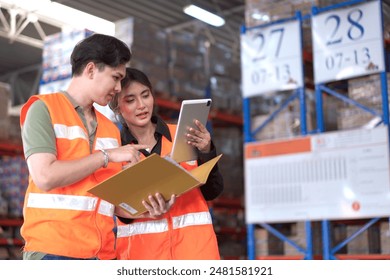 Senior warehouse team leader performs a morning briefing before going to work. Manager or warehouse supervisor is explaining the work plan to the warehouse staffs in the morning before starting work. - Powered by Shutterstock