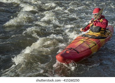 Senior Whitewater Kayaker Paddling Upstream The River Rapid