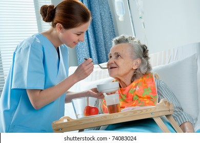 Senior Woman 90 Years Old Being Fed By A Nurse