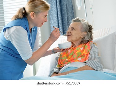 Senior Woman 90 Years Old Being Fed By A Nurse