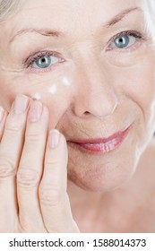 A Senior Woman Applying Eye Cream