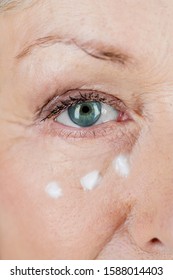 A Senior Woman Applying Eye Cream