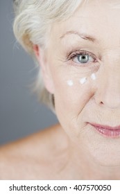 A Senior Woman Applying Eye Cream