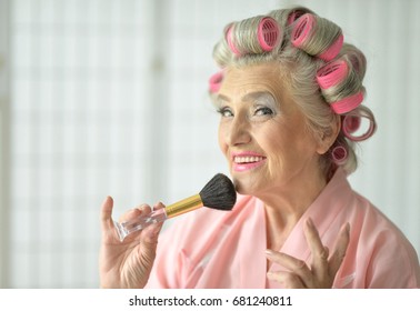 Senior Woman Applying Make Up