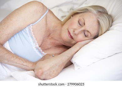 Senior Woman Asleep In Bed