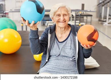 Senior Woman Balances Balls As Exercise For Coordination In Occupational Therapy