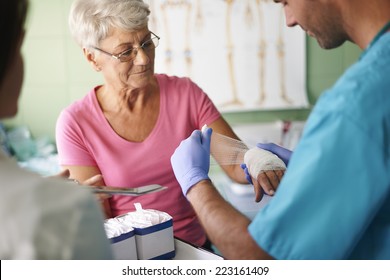 Senior woman with bandage on the hand  - Powered by Shutterstock