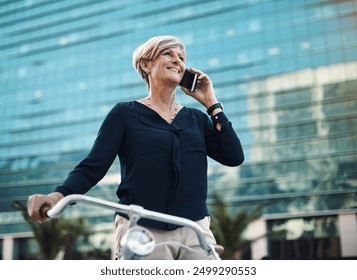 Senior woman, bicycle and phone call in city for business, sustainable travel and mobile app. Technology, networking and professional person in street with transport and online for commute or journey - Powered by Shutterstock