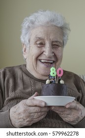 Senior Woman With Birthday Cake