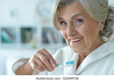 Senior Woman Brushing Her Teeth